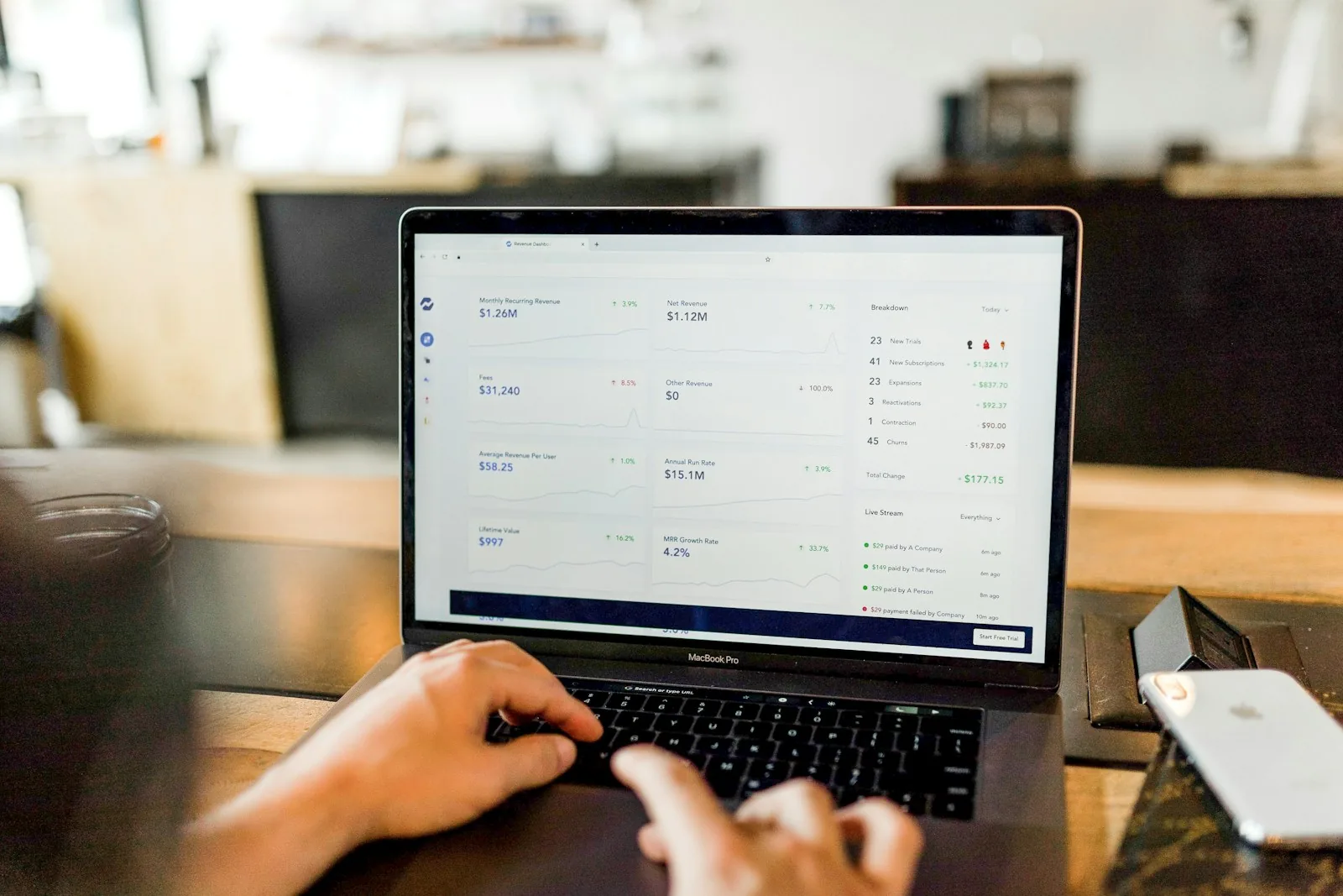 person paying bills online computer