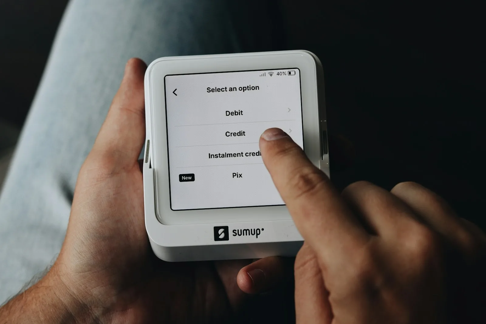 person reading on portable e-reader device