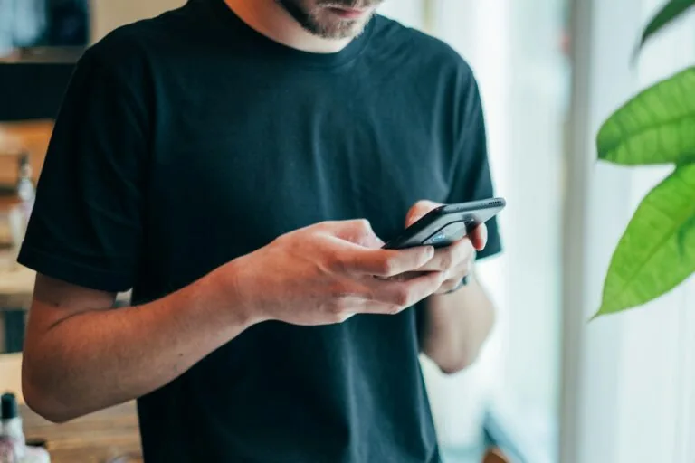 person shopping online with smartphone