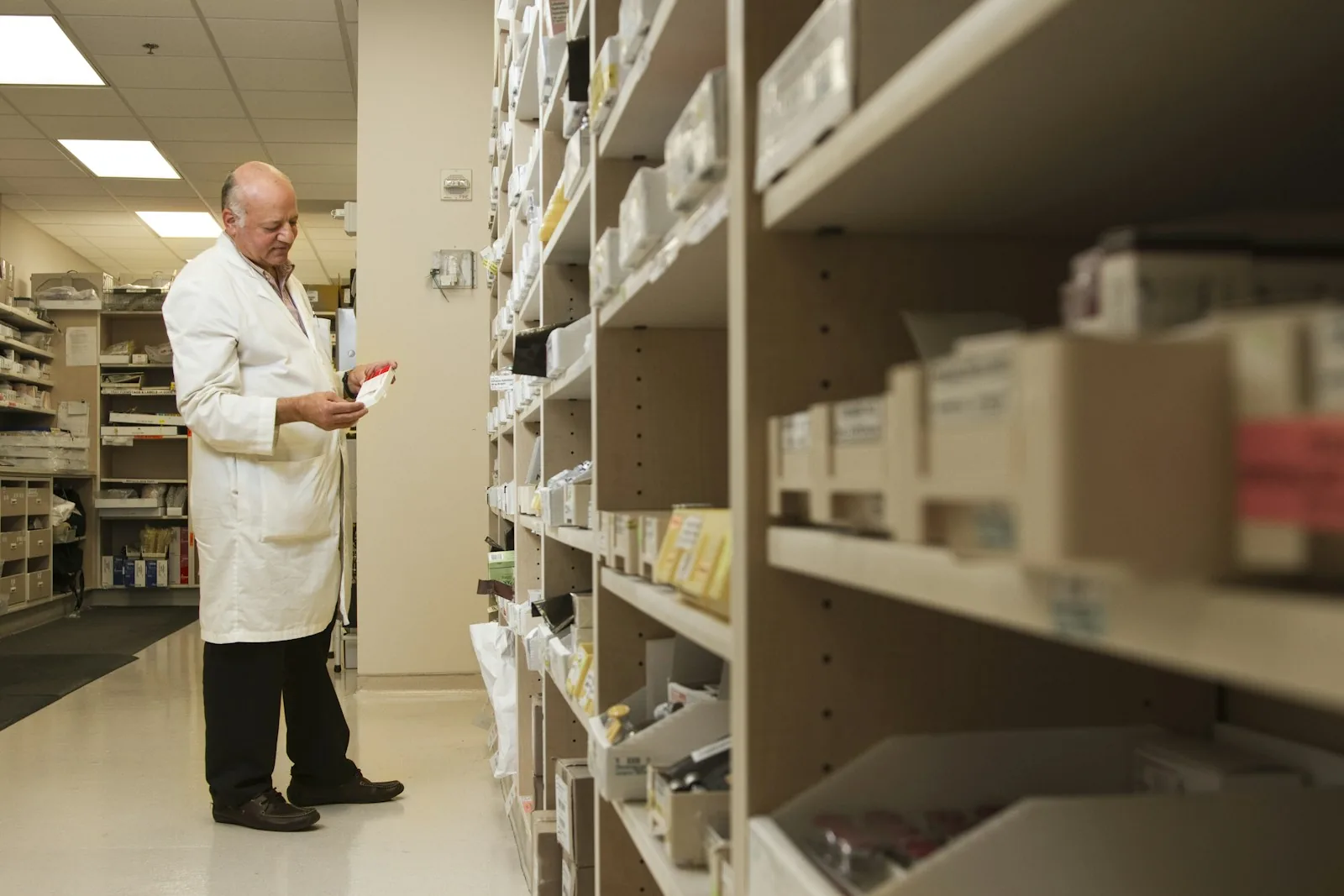pharmacist checking prescription