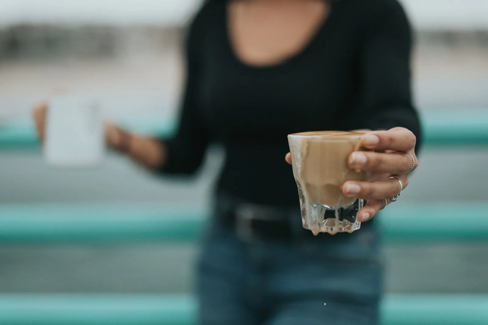 woman bringing reusable coffee mug