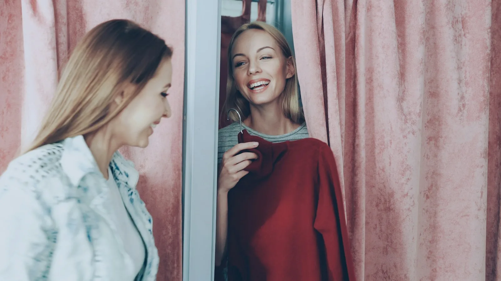 woman trying on clothes fitting room