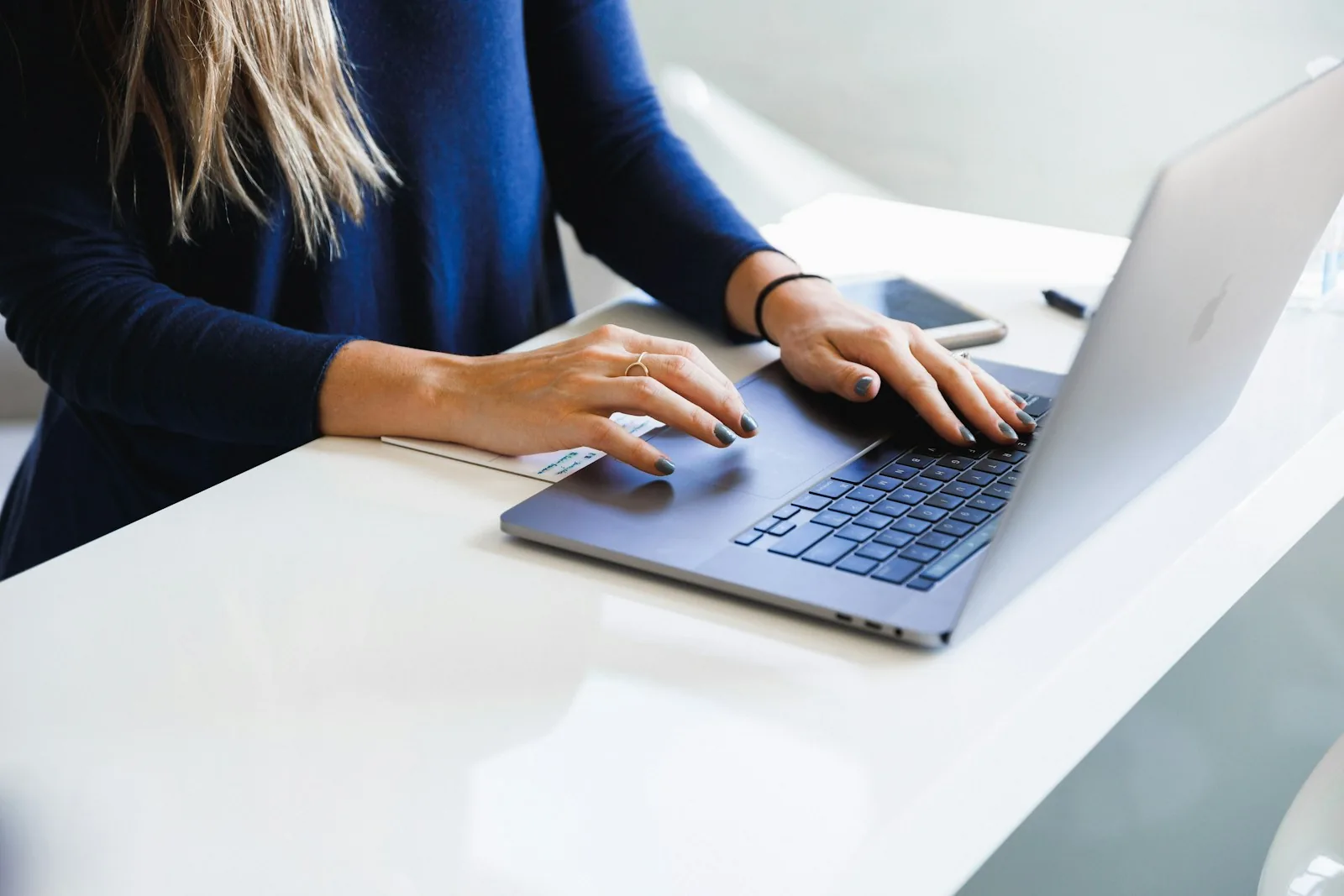 woman using laptop booking flight